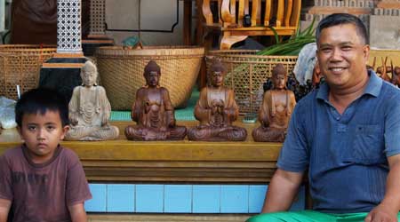 wooden buddha statues in Bali