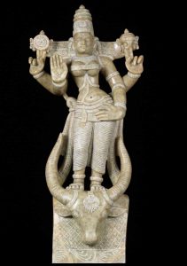 Goddess Durga standing on the head of the buffalo demon Mahishasura