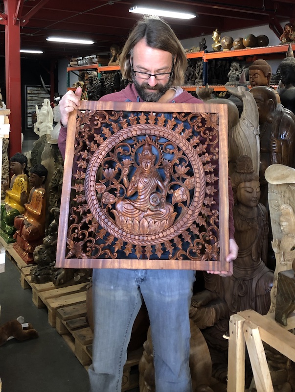 Kyle, founder of Lotus Sculpture, holding the first panel I unwrapped in this shipment of Mr Komang's work