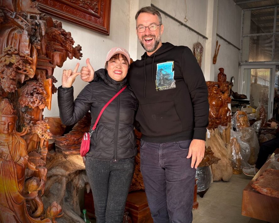 Kyle with female wood artistsan in Vietnam