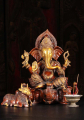 Brass Ganesh Seated on 3 Elephant Head Base 17"