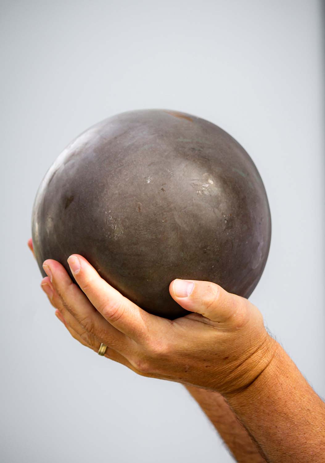 Gray Narmada Shiva Lingam Round Stone with Red & Yellow Representing Shiva as Pillar of Fire 11"