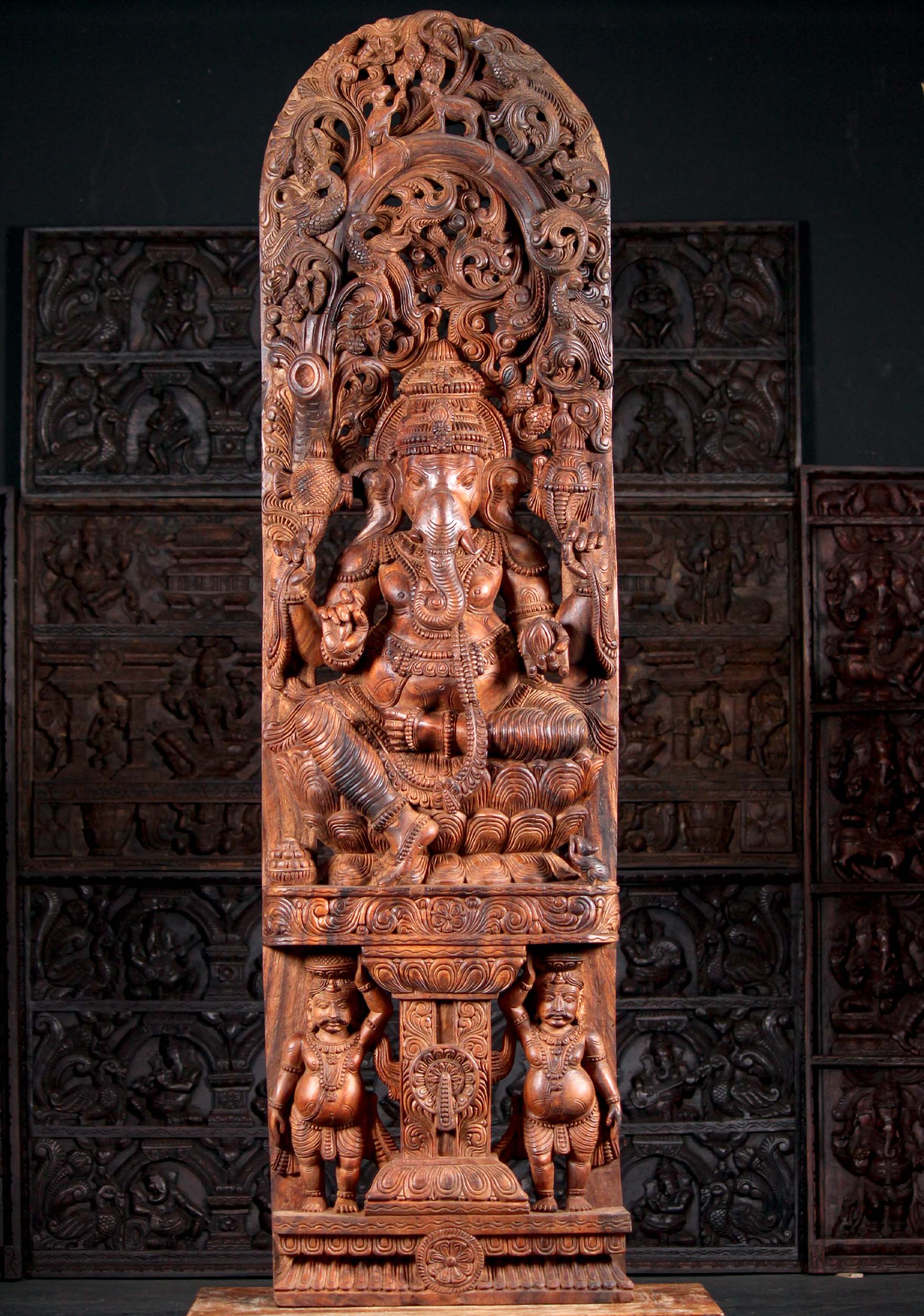 Wooden Carving of Hindu God Ganesh Holding Broken Tusk Seated Above 2 Gana 72"