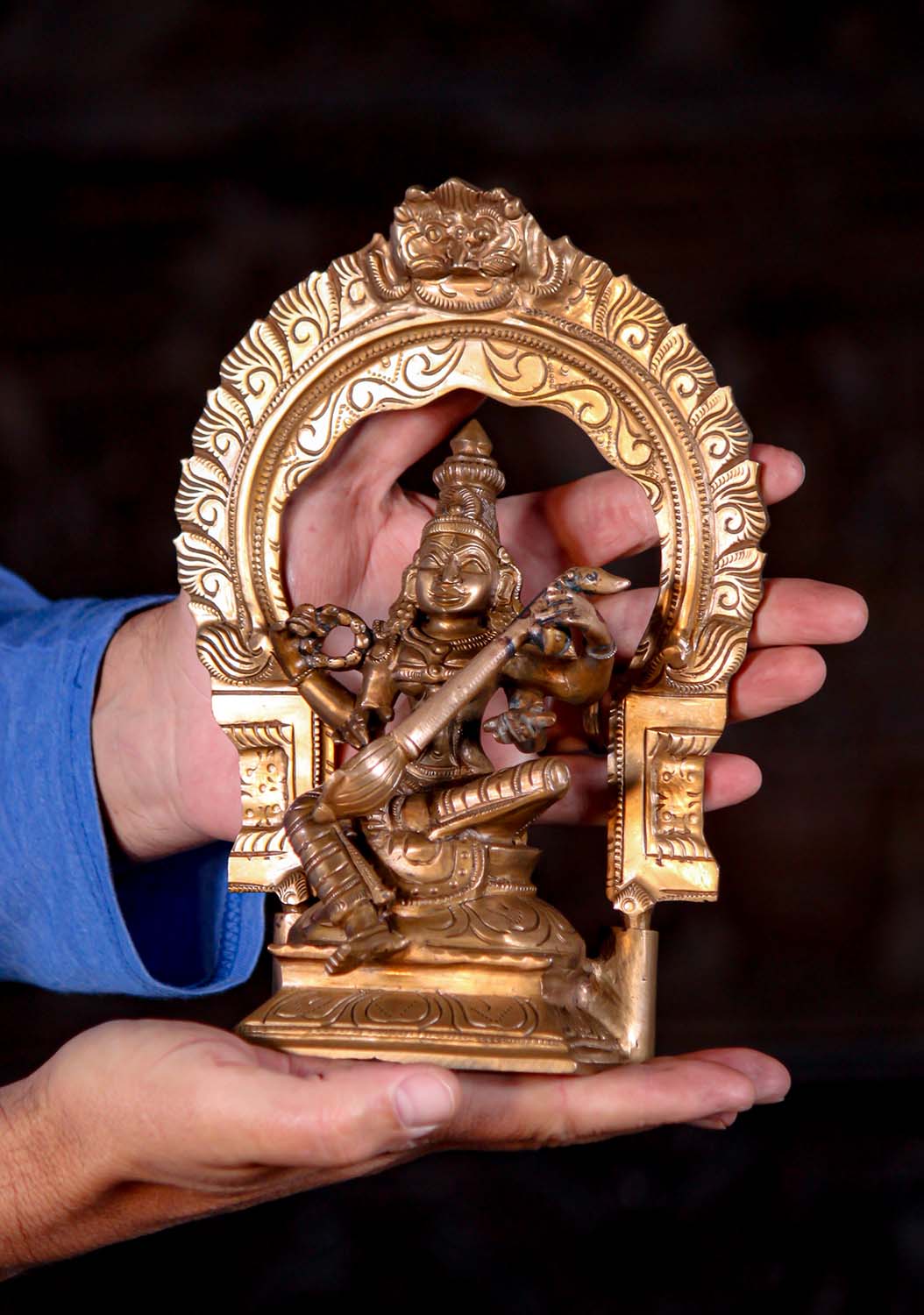 Small Polished Bronze Seated Saraswati Playing the Veena Under Arch Statue 9.5"