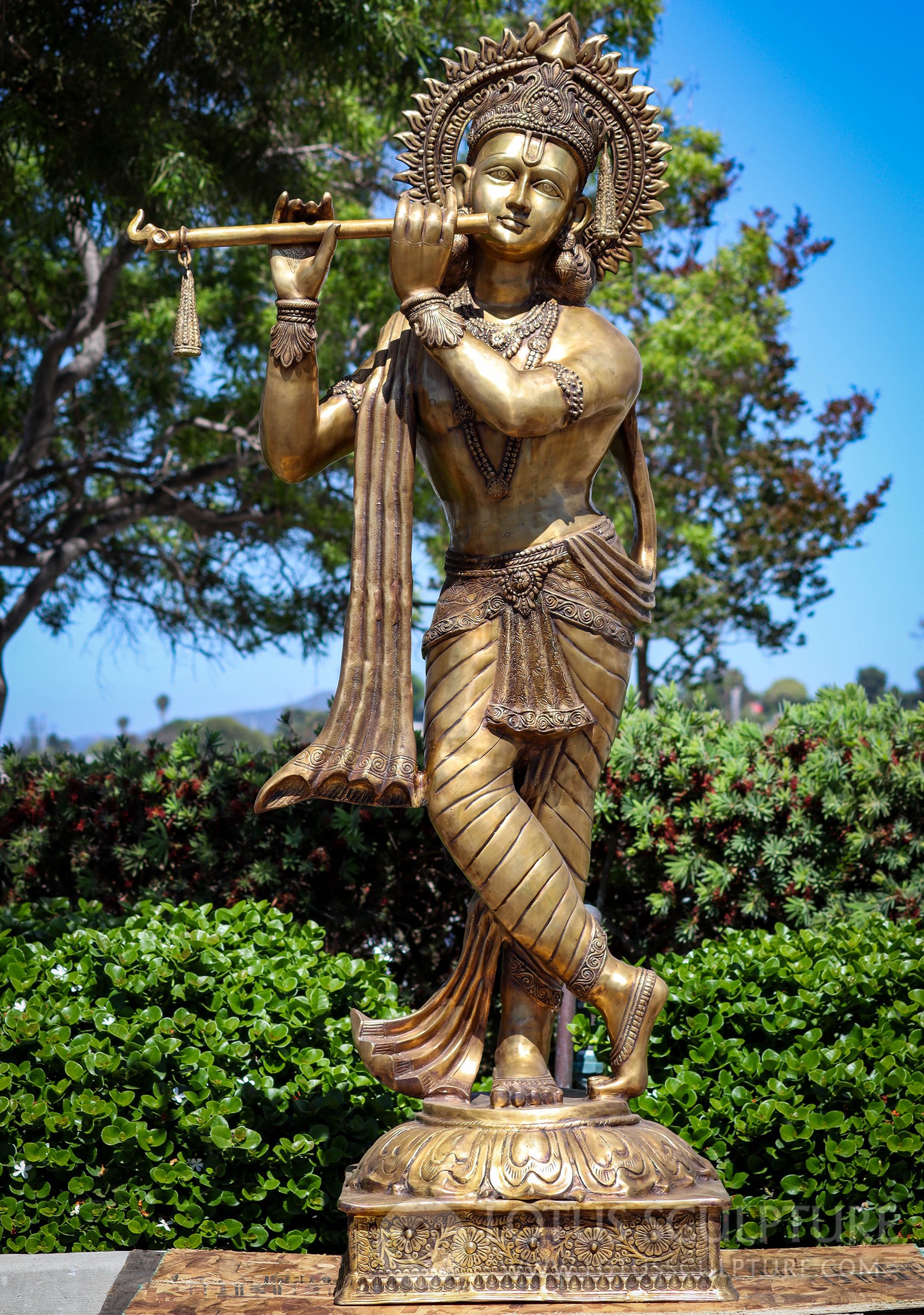 https://www.lotussculpture.com/mm5/graphics/00000001/57/1-large-golden-brass-krishna-playing-flute-leg-crossed-statue-c.jpg