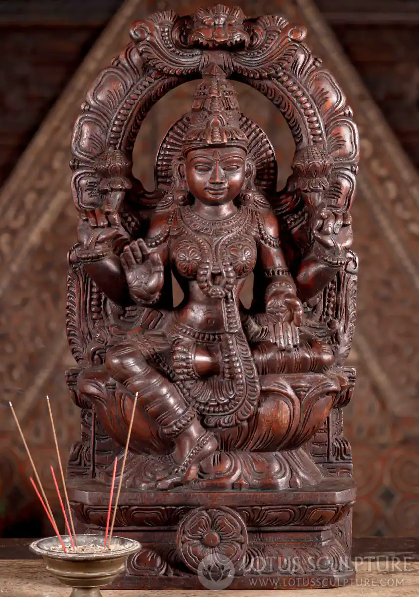 Lakshmi Natural Wood Sculpture Seated Under Mahakala Arch in Abhaya and Varada Mudras 24"