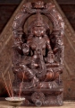 Lakshmi Natural Wood Sculpture Seated Under Mahakala Arch in Abhaya and Varada Mudras 24"