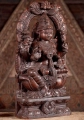 Lakshmi Natural Wood Sculpture Seated Under Mahakala Arch in Abhaya and Varada Mudras 24"