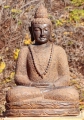 Buddha Lava Stone Sculpture, Meditating in Saffron Color with Brocade Robes 32"