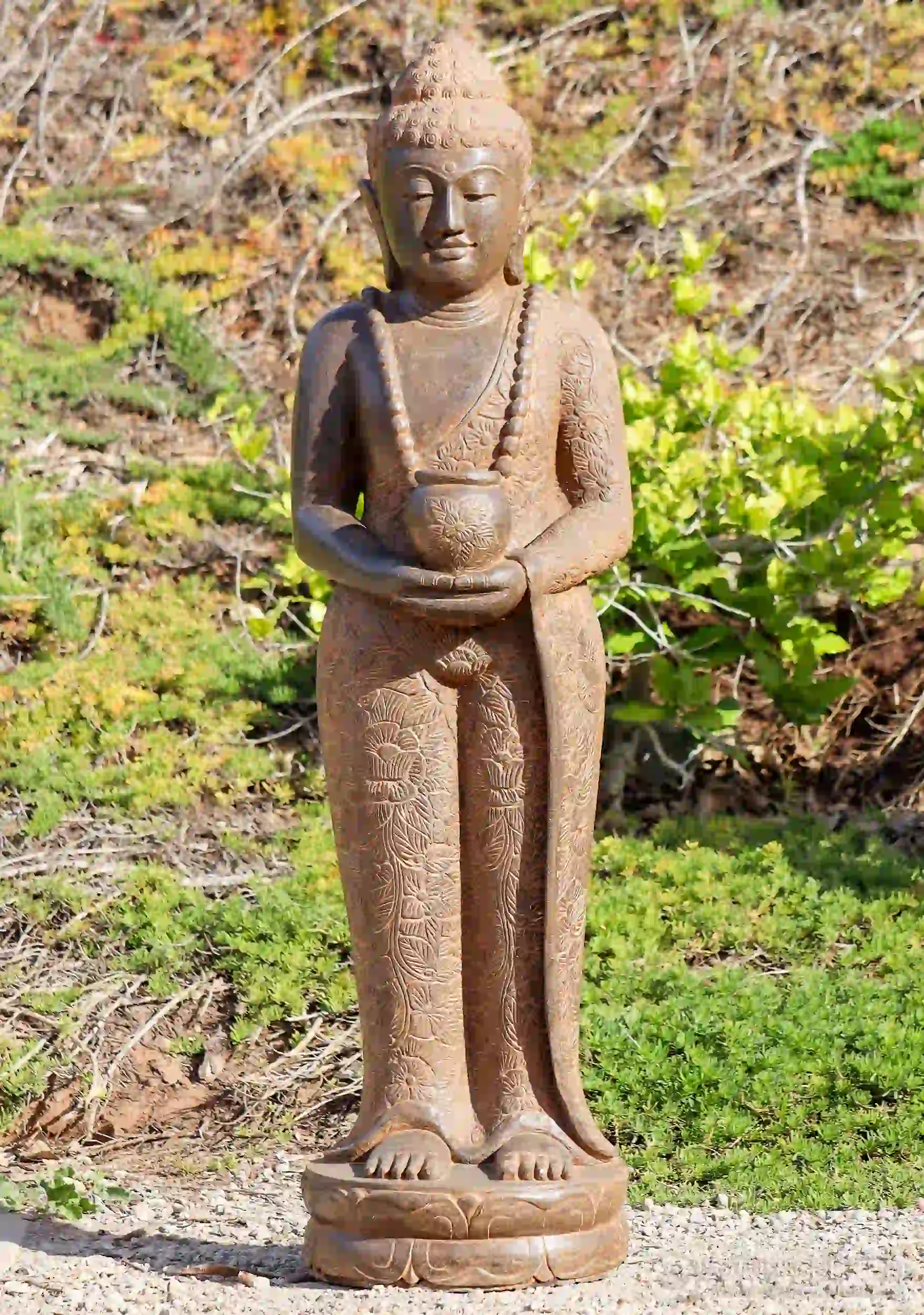 Buddha Sculpture Saffron Lava Stone Standing with Alms Bowl in Floral Robe 57"