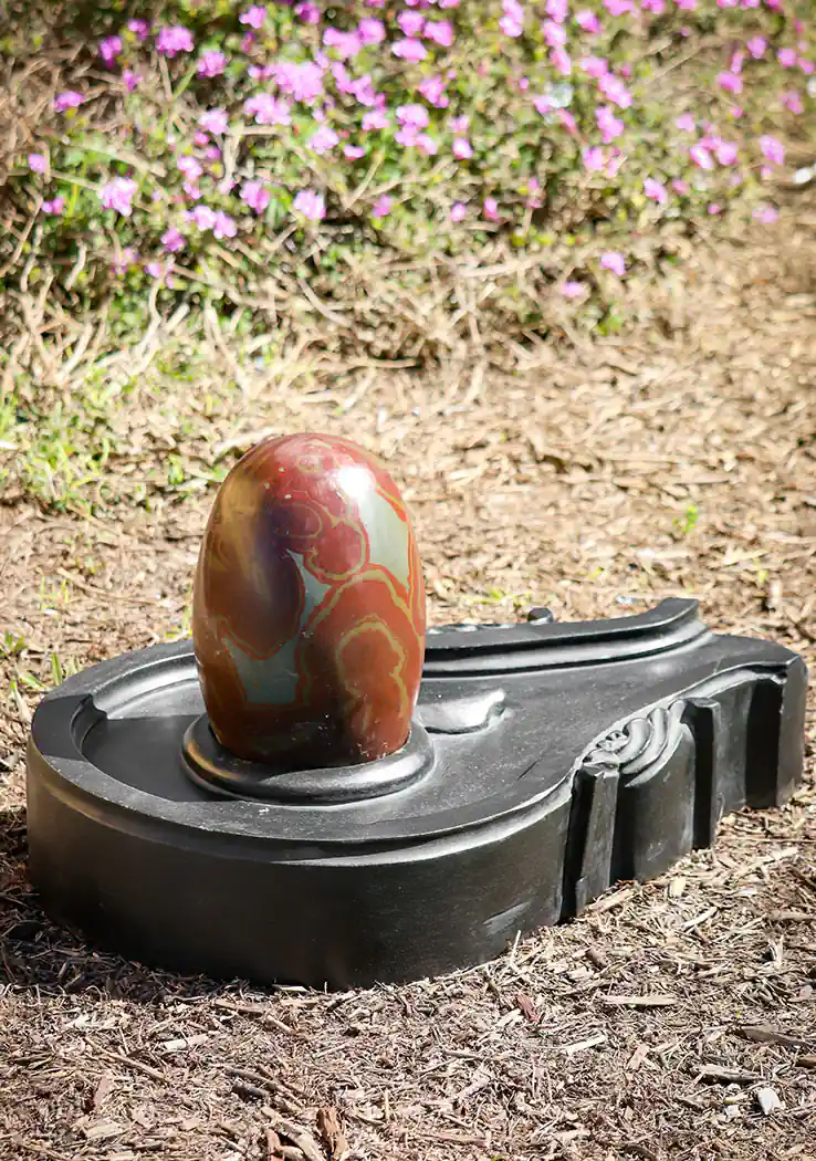 Narmada Shiva Lingam with Red and Grey Marbling on Black Stone Yoni Base 24"