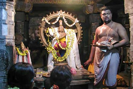 A Brahmin priest along side Nataraja and Ganesha